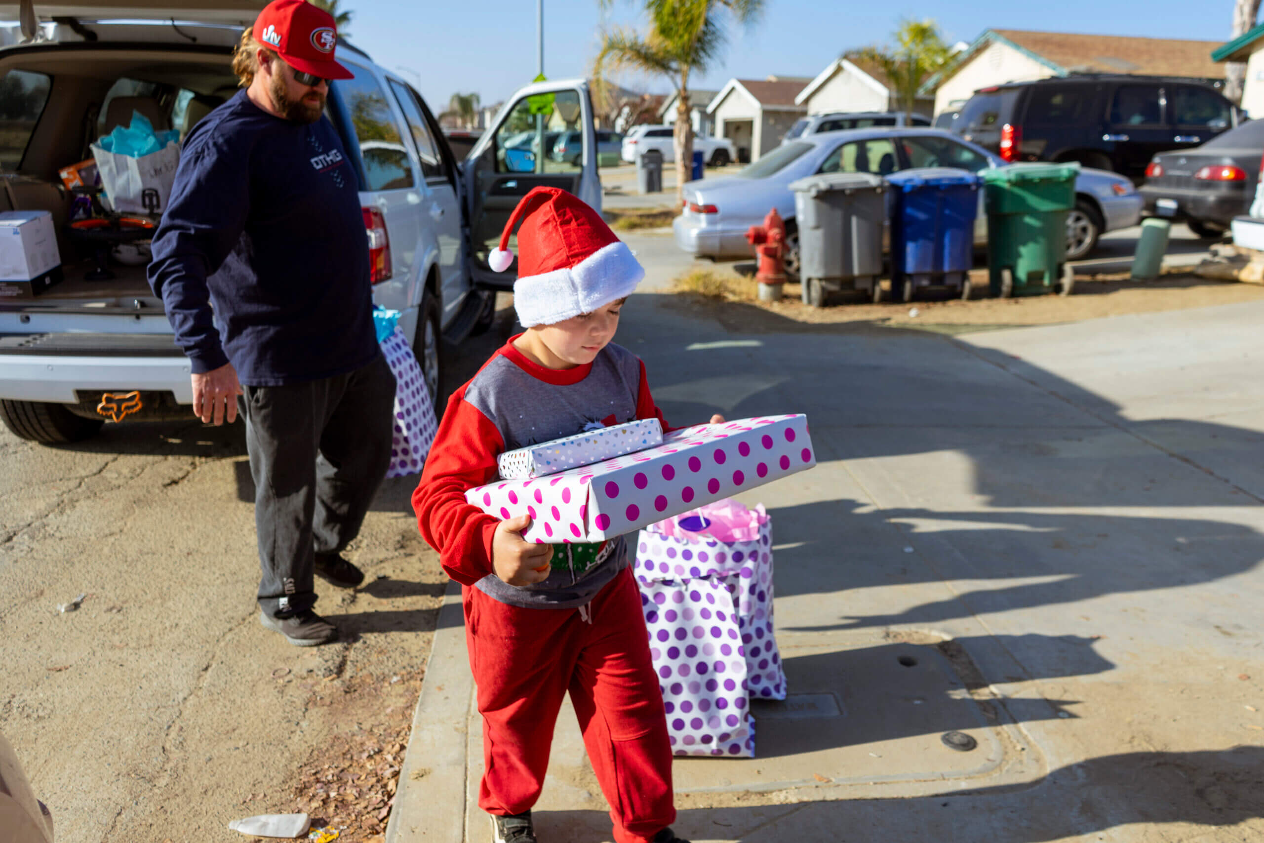 Young Child Carrying Presents
